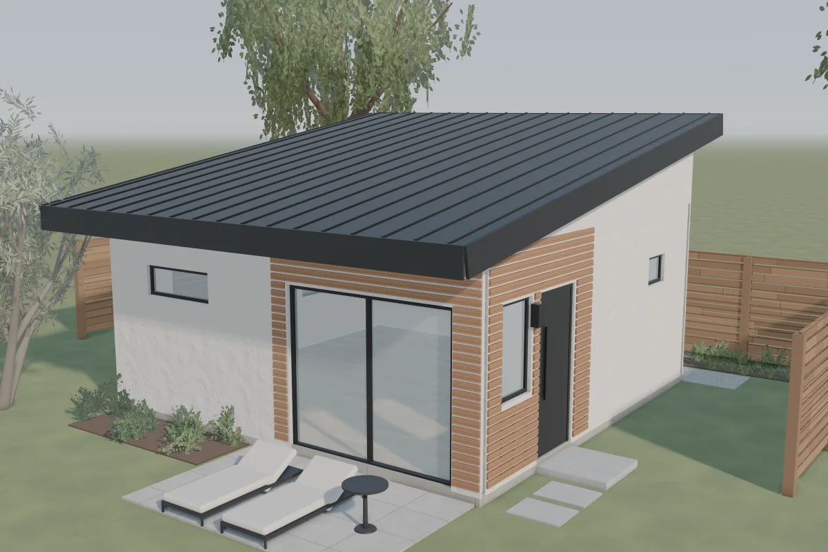 The Coral Tree, a contemporary ADU with a single-slope metal roof, smooth stucco, cedar slats and a wide glass slider onto a paver patio